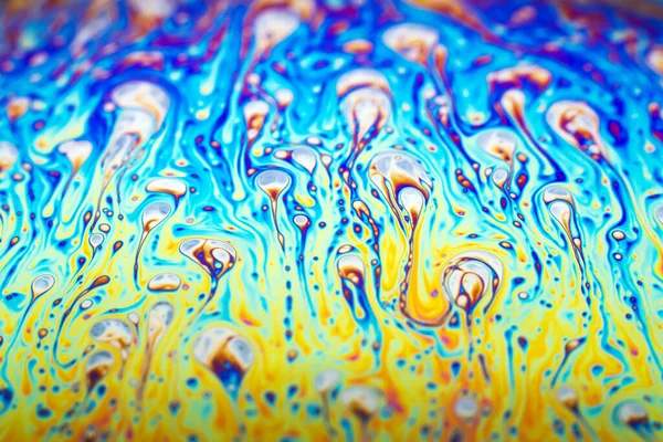 Beautiful psychedelic abstraction formed by light on the surface of a soap bubble.