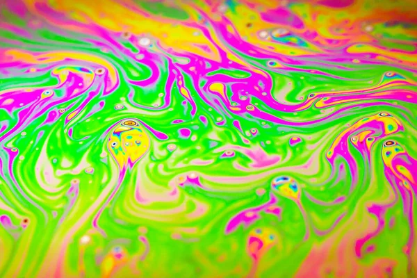 Beautiful psychedelic abstraction formed by light on the surface of a soap bubble.