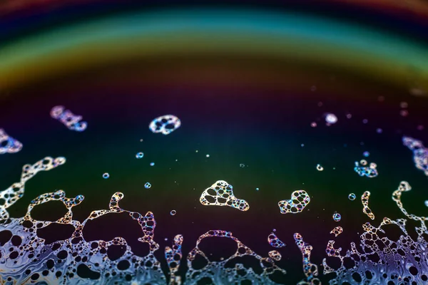 Beautiful psychedelic abstraction formed by light on the surface of a soap bubble.