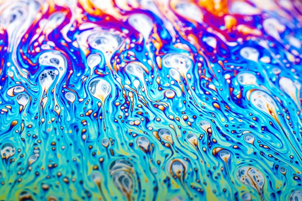 stock image Beautiful psychedelic abstraction formed by light on the surface of a soap bubble.