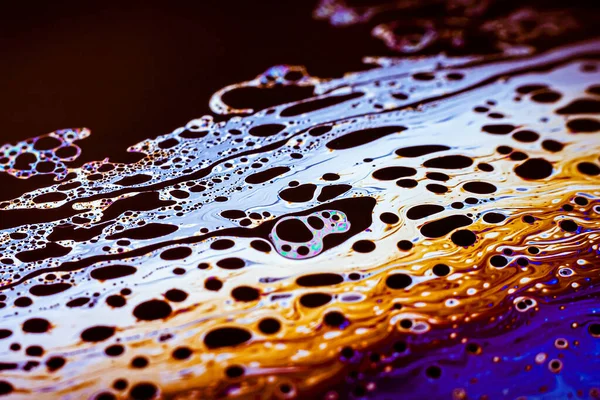 Beautiful psychedelic abstraction formed by light on the surface of a soap bubble.