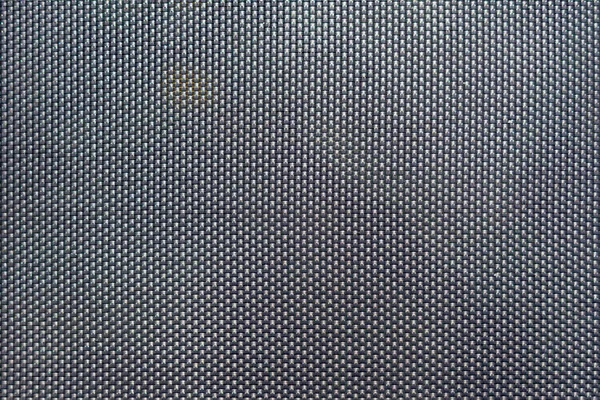 Close-up of gray synthetic fabric texture, background.