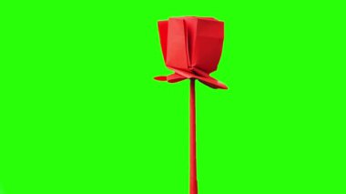 Yeşil ekran üzerindeki kırmızı origami lalesi