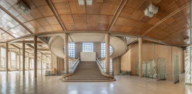 Paris, France - 09 09 2025: Palais d'Iena. Front view of the monumental double-spiral staircase, in the shape of a heart or horseshoe, and its banister created by the ironworker Raymond Subes
