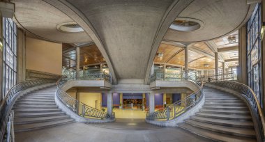 Paris, France - 09 09 2025: Palais d'Iena. Front view of the monumental double-spiral staircase, in the shape of a heart or horseshoe, and its banister created by the ironworker Raymond Subes