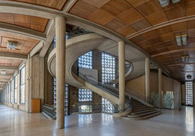 Paris, France - 09 09 2025: Palais d'Iena. Panoramic view of The hypostyle hall and the monumental double-spiral staircase