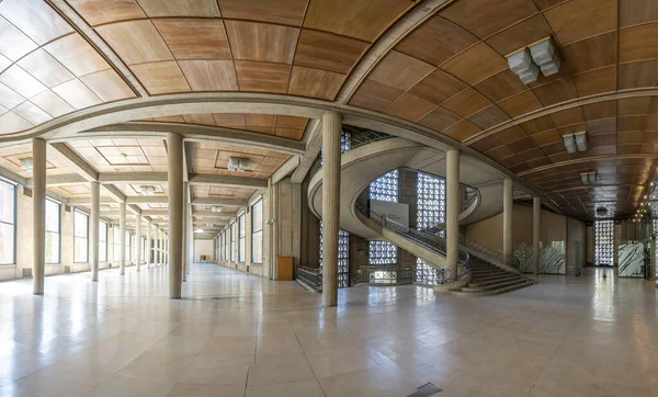 Paris, France - 09 09 2025: Palais d'Iena. Panoramic view of The hypostyle hall and the monumental double-spiral staircase