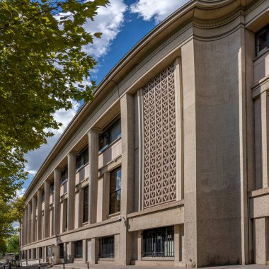 Paris, France - 09 09 2025: Palais d'Iena. View from the side of the building with concrete columns and screens