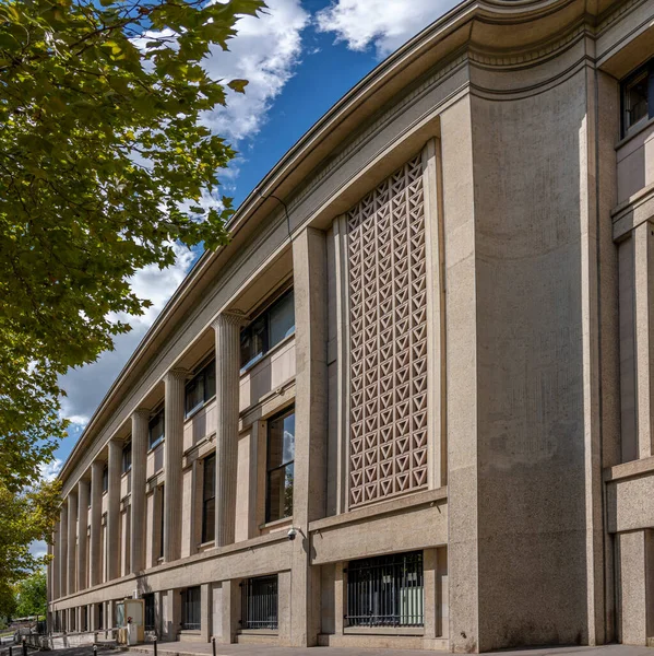 Paris, France - 09 09 2025: Palais d'Iena. View from the side of the building with concrete columns and screens