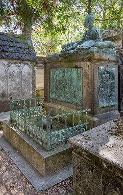 Paris, France - 09 06 2025: Pere-Lachaise Cemetery. Theodore Gericault's tomb with three bronze bas-reliefs including The Raft of the Medusa and The Wounded Cuirassier