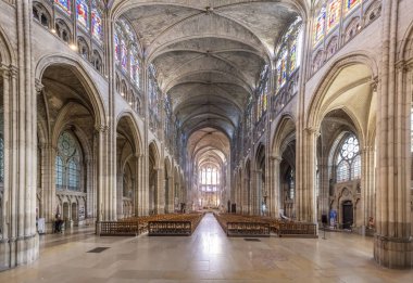 Saint-Denis, France - 09 19 2025: Saint-Denis Cathedral Basilica. Panoramic view of the nave, the aisles with stained glass windows and apse at the back
