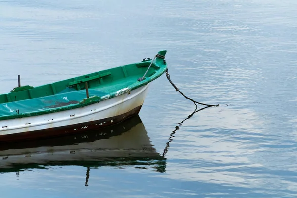 fishing boat on calm sea alone