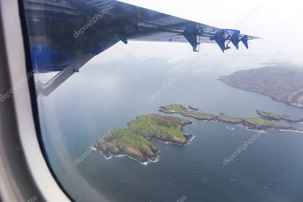 The view from the airplane as it flies over the Isle of Barra, Outer Hebrides, Scotland. High quality photo