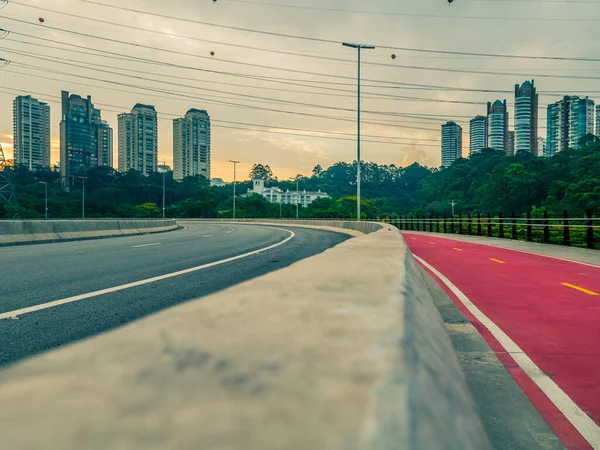 Laguna Bridge, bike lane, trees and office buildings