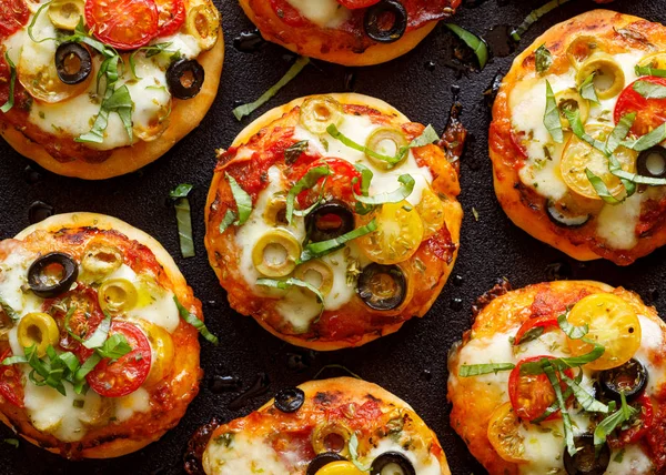 Mini Pizzas Addition Cherry Tomatoes Olives Mozzarella Cheese Fresh Basil — Stock Photo, Image