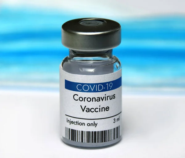 Coronavirus vaccine vial on white background and face mask