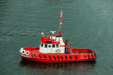 BERGEN, NORWAY - 2015 MAY 28. Bergen red harbor tug boat clipart