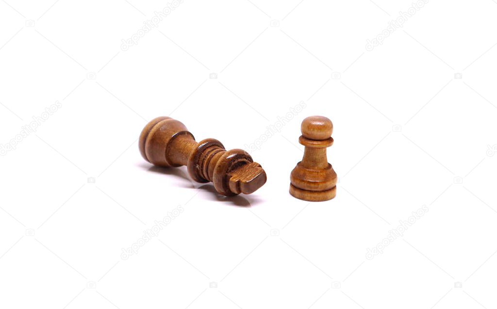 Chess coins on white background - King defeated by a pawn