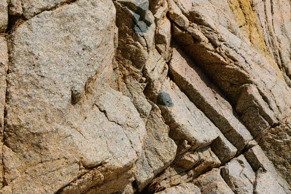 Textuur van de natuursteen achtergrond buitenshuis, patroon — Stockfoto