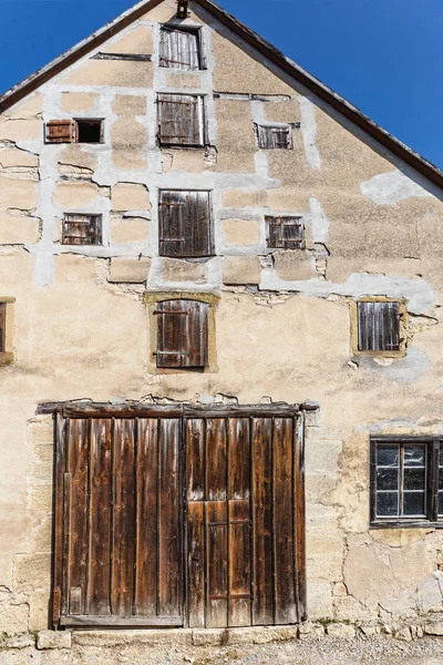 old house with a large wooden gate in the small German town of Rothenburg ob der Tauber