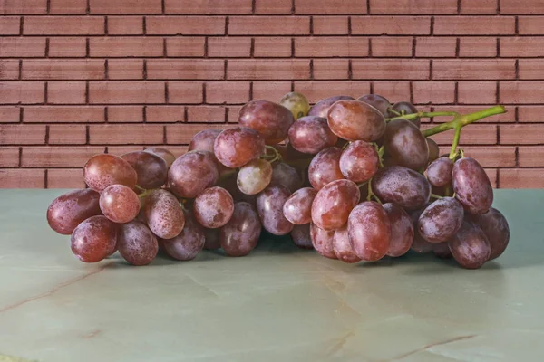 Juicy Fresh Red Grape Tassels Lying Table Brick Wall — Stock Photo, Image