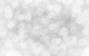 Beyaz ve gümüş soyut arkaplan arkaplan ve duvar kâğıdı Noel için bokeh ışıkları ile bulanık.