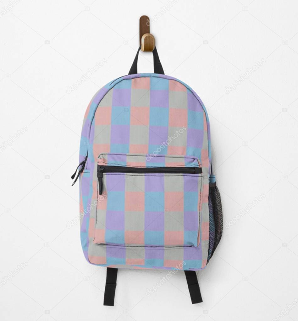 Backpack in pastel squares hanging on the wall