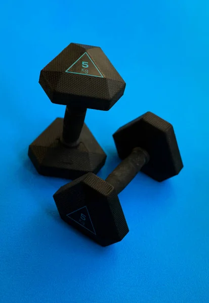 Two Black Weights Blue Background — Stock Photo, Image