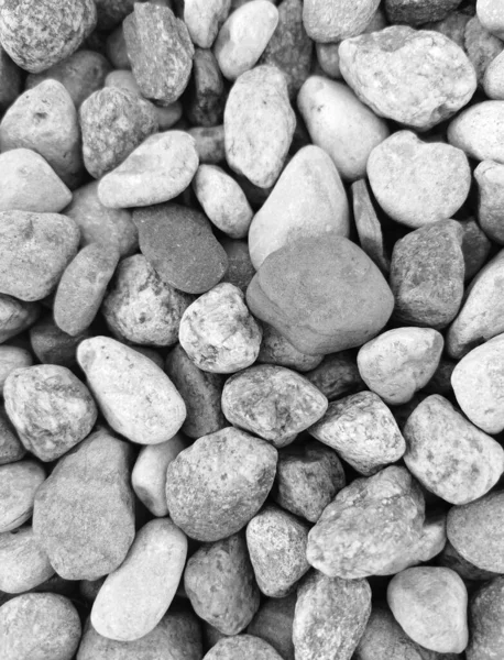 Black and white river stones. A collage of river rocks.