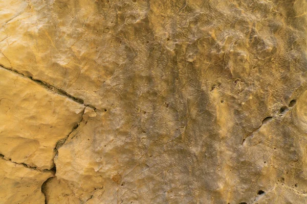 Fundo Rocha Amarela Textura Rocha Tem Várias Rachaduras Buracos — Fotografia de Stock