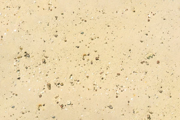 Pláž písek textury s malou skálou pro pozadí — Stock fotografie