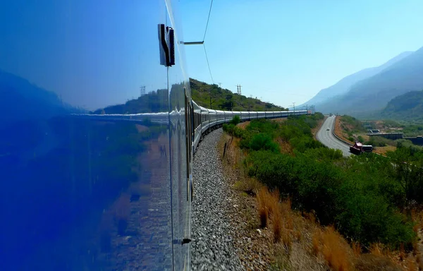 The world reflected in luxury train travel snaking through the Karoo in South Africa, from Pretoria to Cape Town