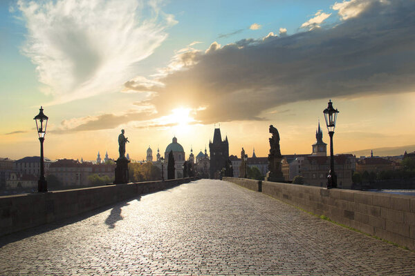 Beautiful view of Old Town Tower of Charles Bridge at dawn in Prague, Czech Republic