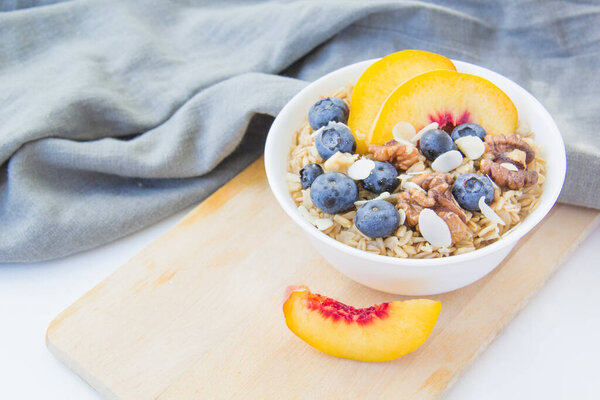 Oatmeal porridge with blueberries. Superfood for healthy nutritious breakfast
