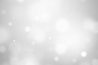 Bokeh soyut, gümüş ve beyaz, güzel bir arkaplan. Yumuşak renkli ışık parıltısı. Arkaplan ya da tasarım ürünleri, kozmetik reklamlar, kış, Noel, lüks, güzellik, bebek, modern, yaratıcı