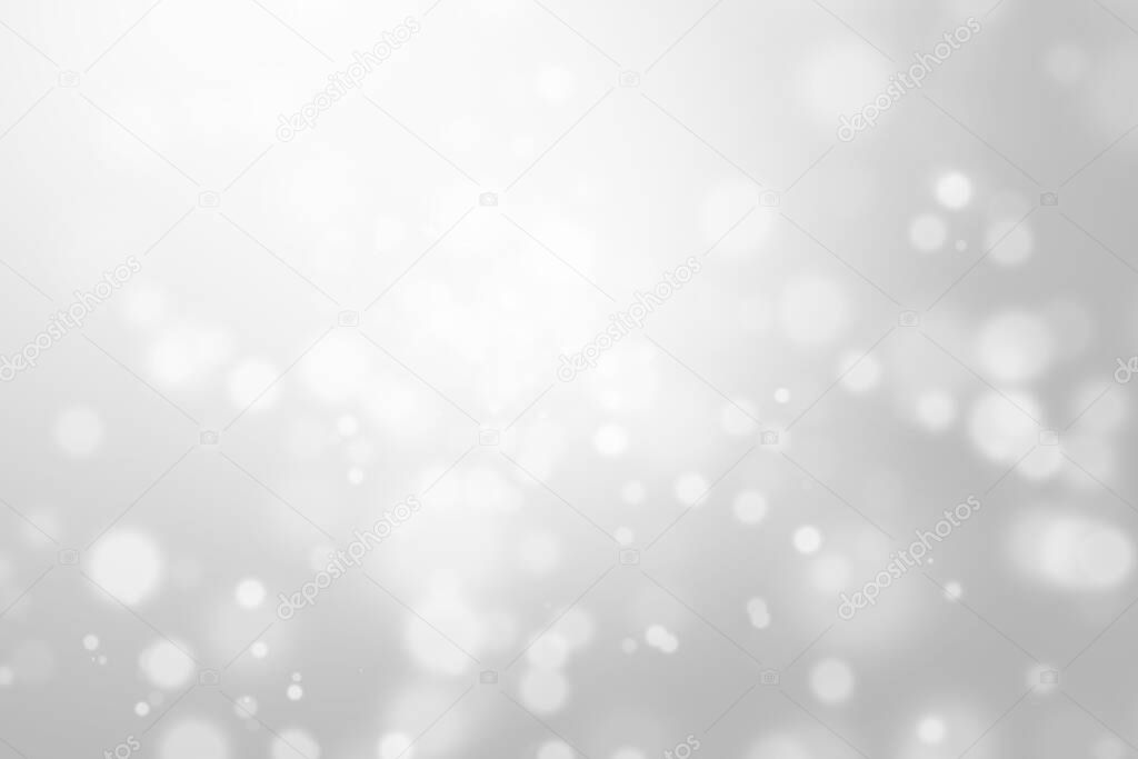 Bokeh abstract blurred silver and white beautiful background. Soft color light glitter sparkles. element for backdrop or design cosmetic ads, winter, christmas, luxury, beauty, baby, modern, creative