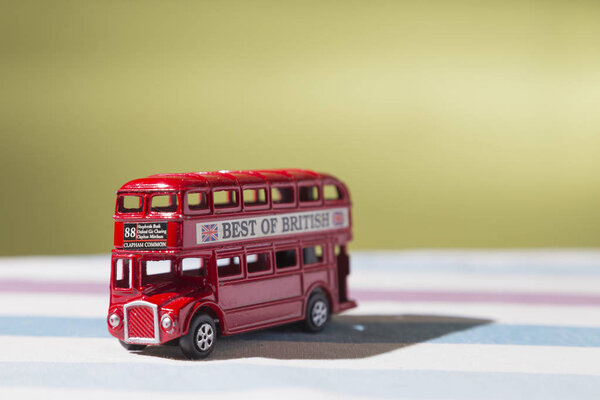 representation in a metal toy of the classic red bus that transits the streets of London,