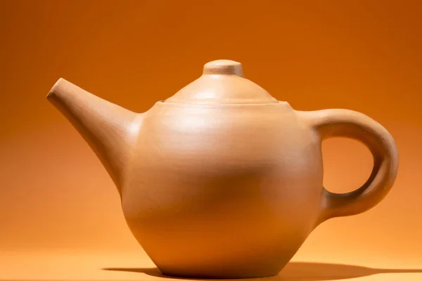 Profile View Red Clay Teapot Placed Orange Space — Stok fotoğraf