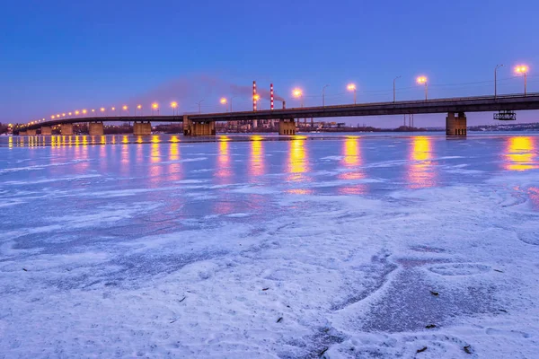 Sunset in purple tones, the Dnieper River, view of the South Bridge, the Dnieper thermal power plant, the city of Dnieper, Ukraine, January 2017