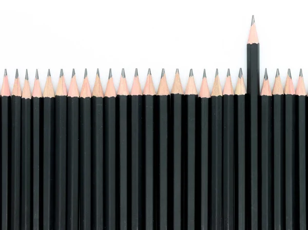 Close Black Pencils White Background Stand Out Crowd Concept — Stock Photo, Image