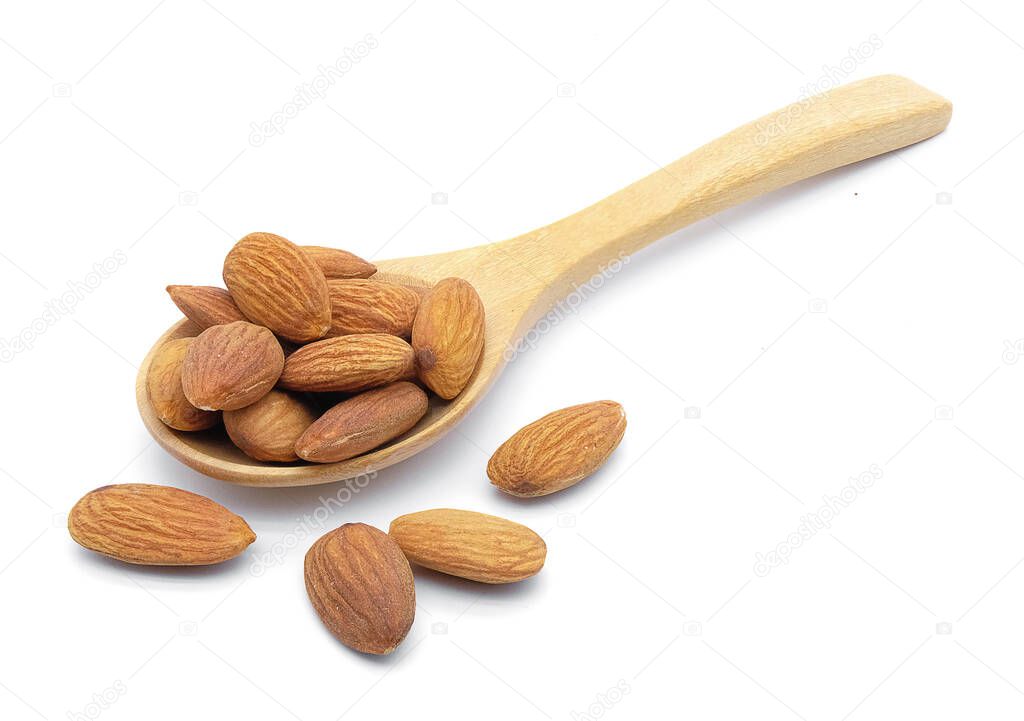 almonds  in spoon on white background isolate