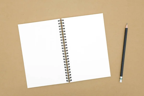 茶色の背景のノートブックトップ表示のコピースペース — ストック写真