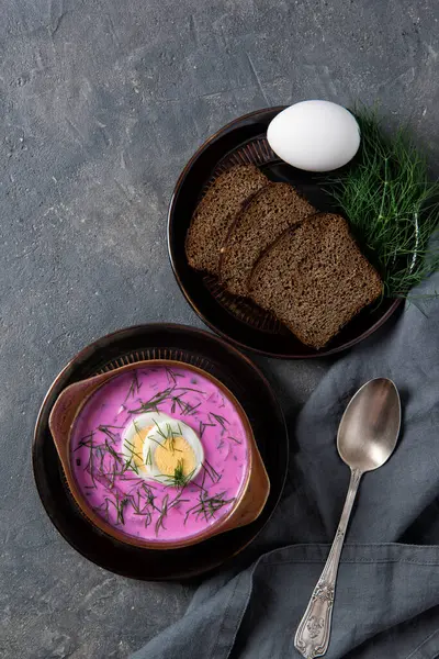 Cold beetroot soup okroshka with kefir served with boiled eggs, dill and bread slices, rustic background, top view — Stock Image Cold Beetroot Soup Okroshka Kefir Served Boiled Eggs Dill Bread Royalty Free Stock Photos