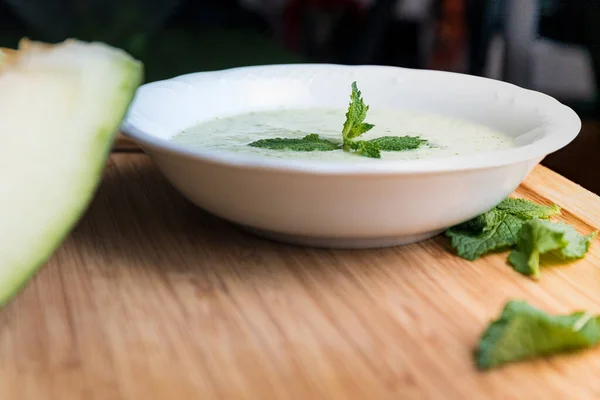 Melon soup with cucumber and mint. Healthy summer food