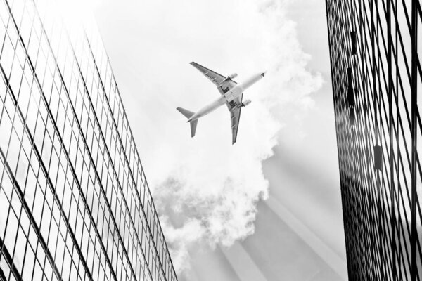 Airplane flying in the sky over city