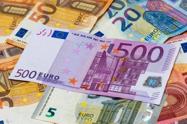 500 euro bank note among 50, 20,10 and 5 euro bank notes. Close-up view