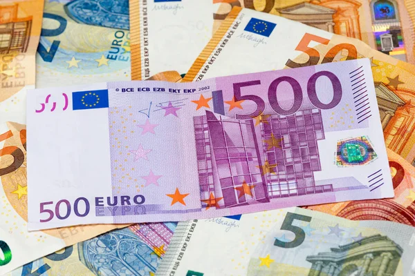 500 euro bank note among 50, 20,10 and 5 euro bank notes. Close-up view