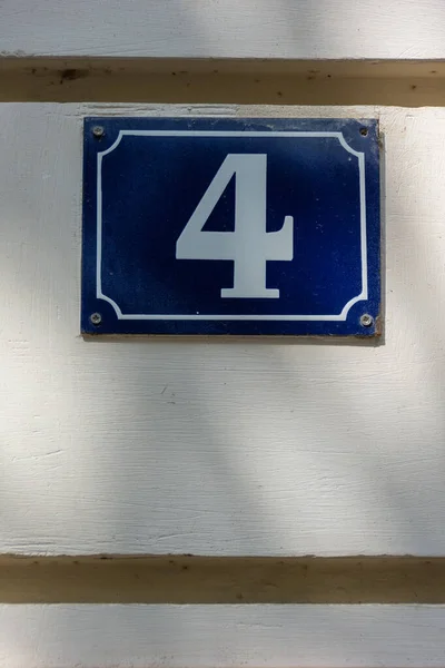 Number 4, building number plate, typical french parisian style, Paris, France