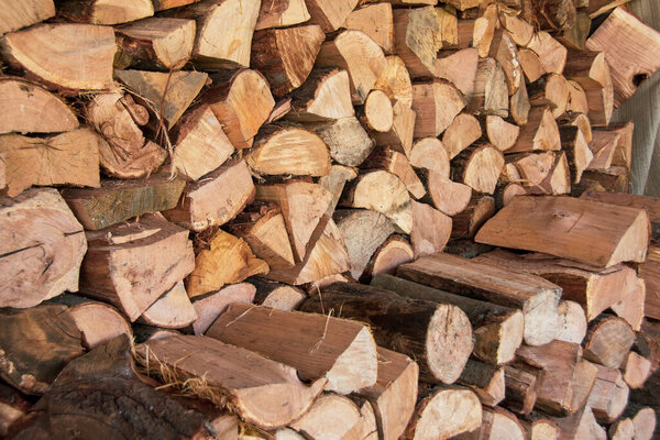 Pile of stacked firewood, texture for background