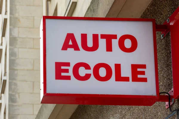 Sign indicating `Auto cole` written in French. Sign of a driving school. France